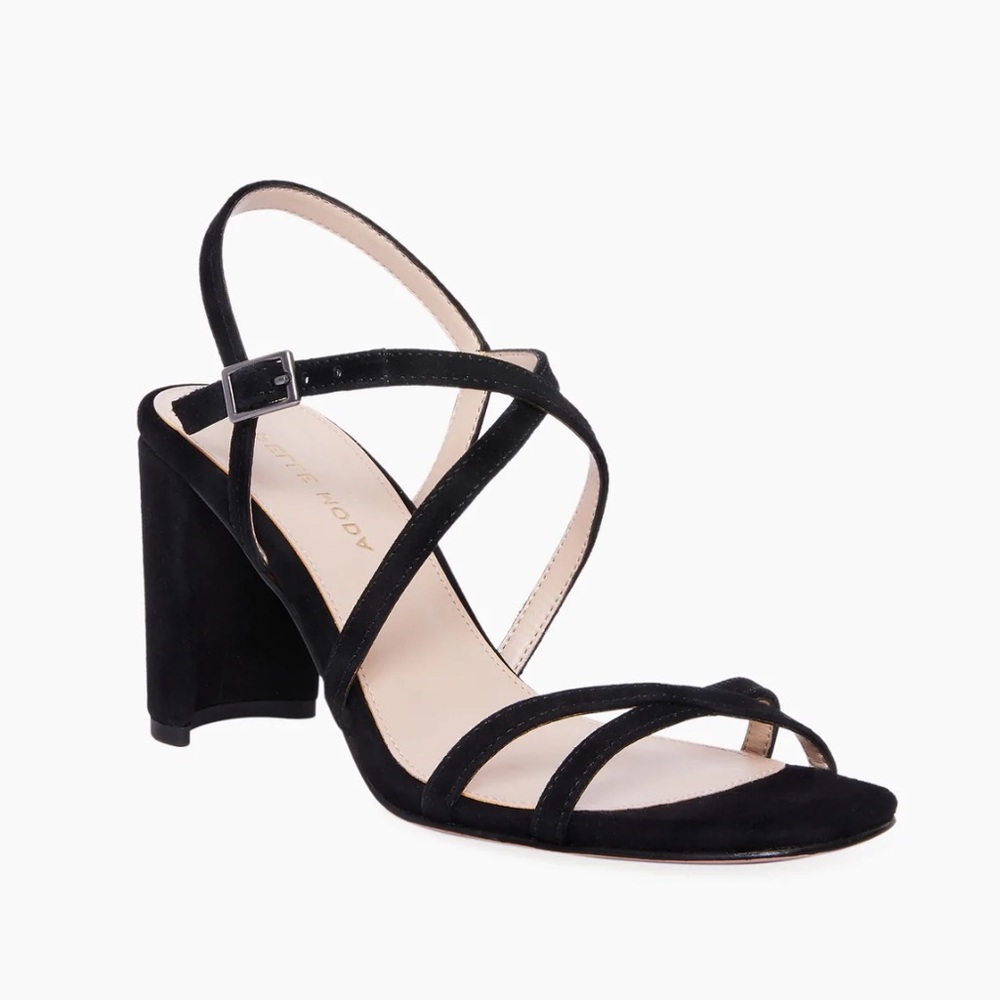 Noreen suede 3 in heel, adjustable buckle, criss cross strap & leather outsole.